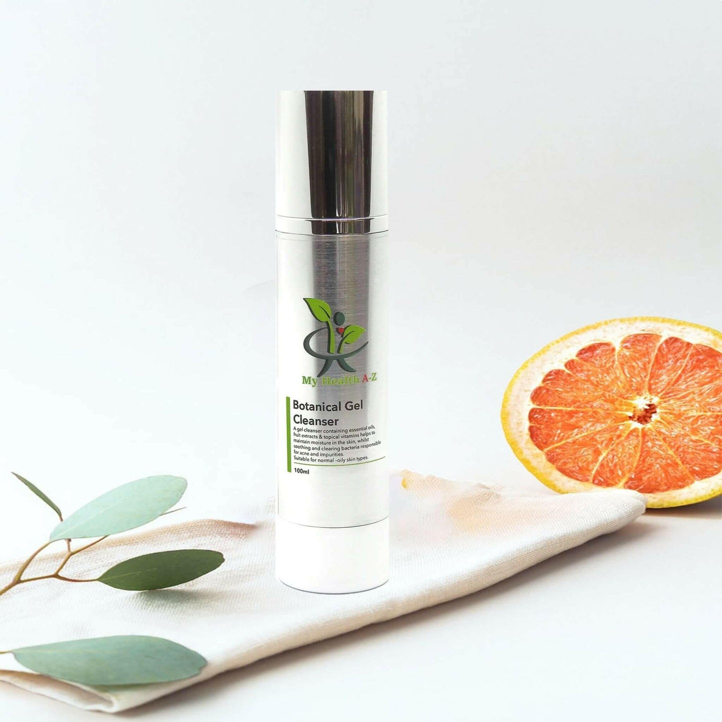 Botanical Gel Cleanser in bathroom on a towel next to it green leaf