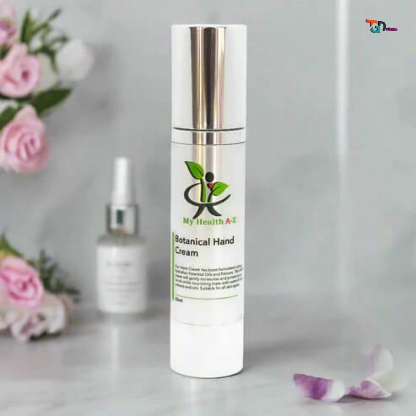 on the left pink flowers and a bottle of botanical hand cream