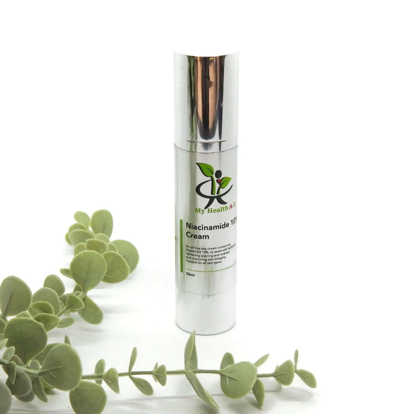 Niacinamide 10% Cream bottle in front some leafs