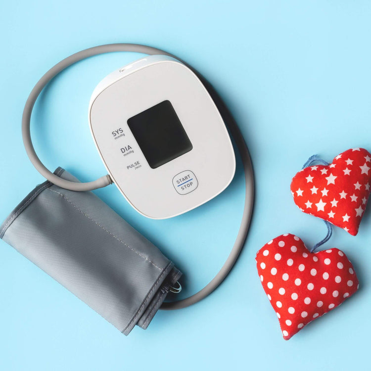 blood presser monitor and 2 hearts of of fabric with dots and star on it