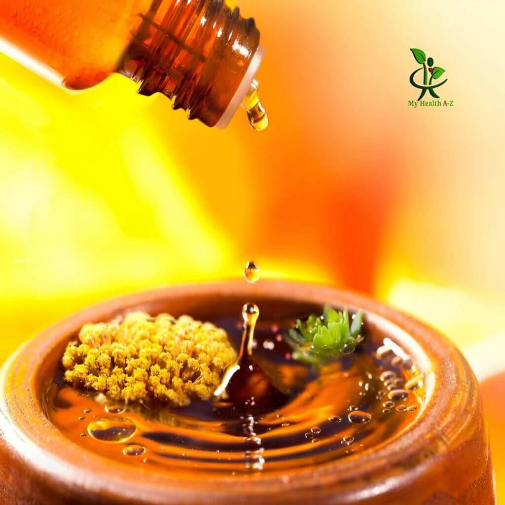 Frankincense Essential Oil  dripping onto a burner