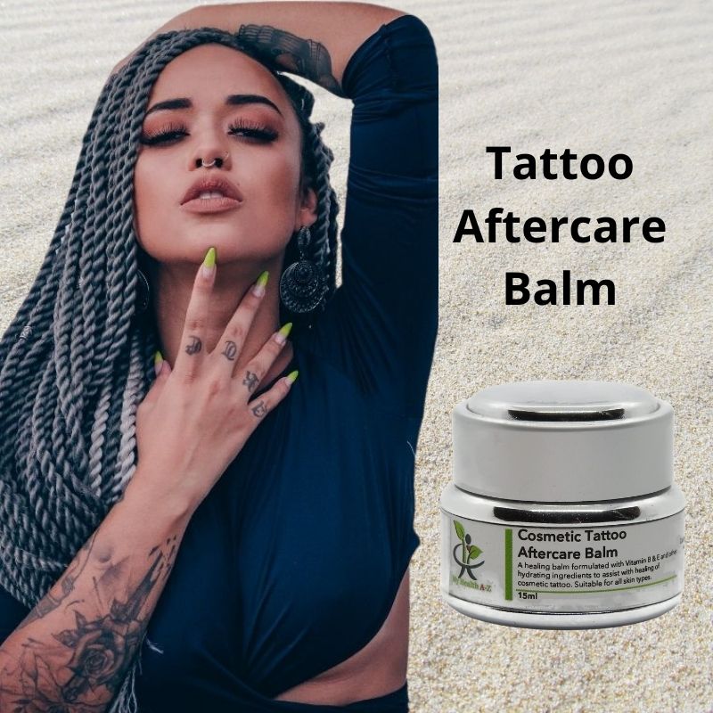 Pretty woman with Tattoos and the Cosmetial Tattoo Balm product