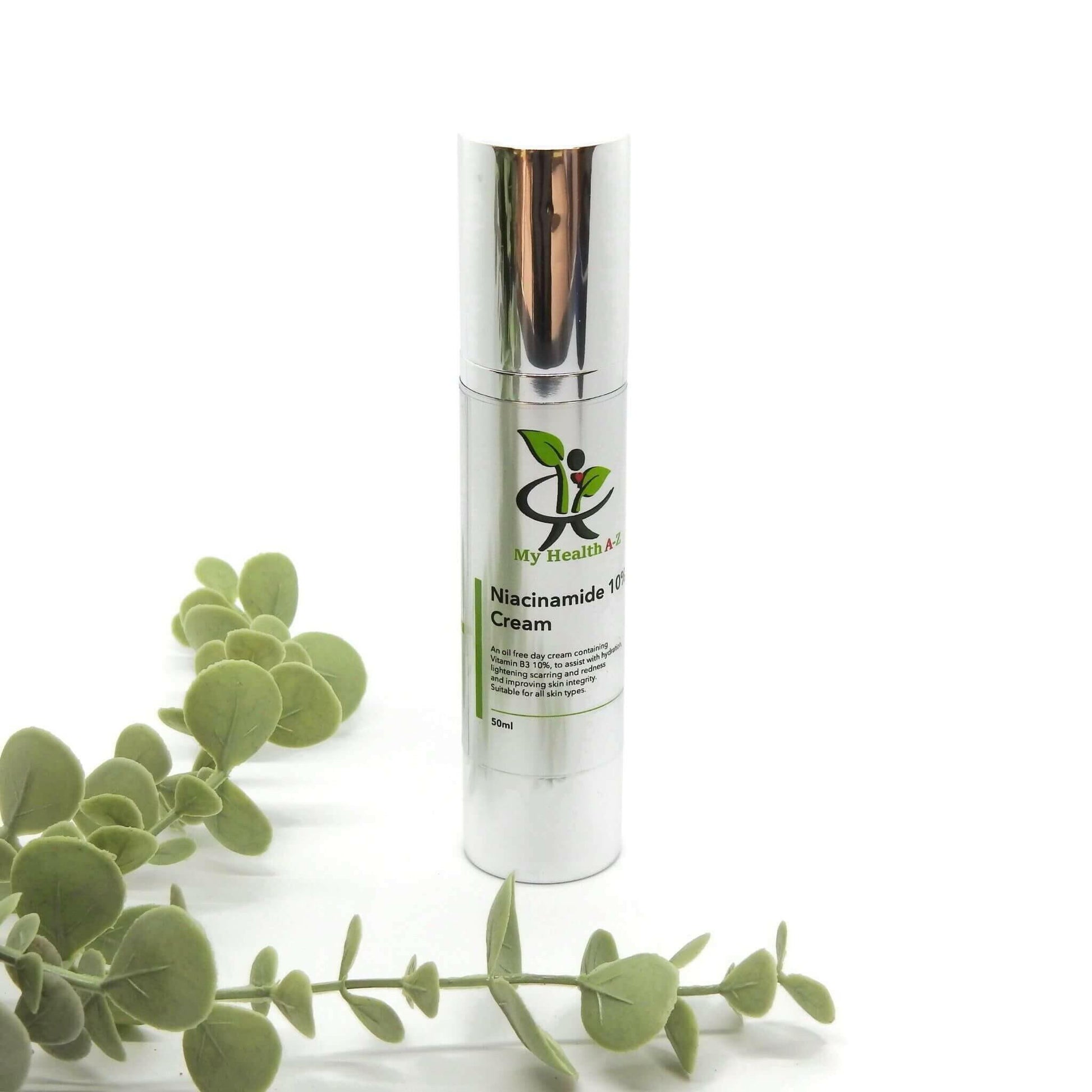 Niacinamide 10% Cream bottle in front some leafs