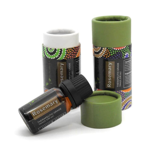 Rosemary essential oil bottles with green caps on a white background