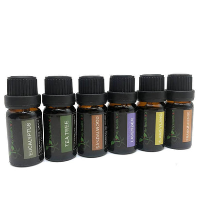 Set of essential oil bottles with labels on a white background